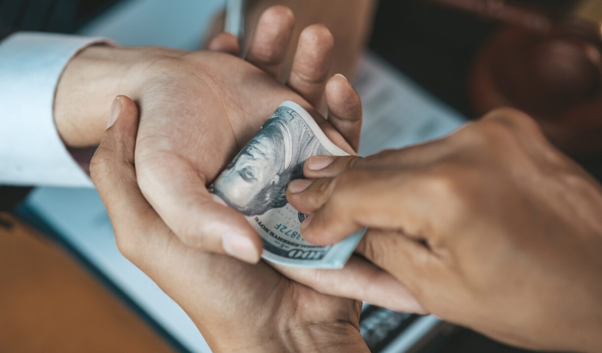 individuals are giving bribes to officials in orde wqz4z9h