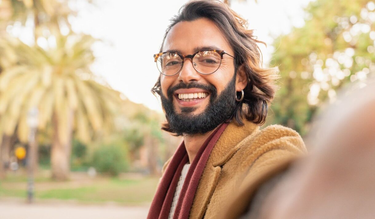 attractive man with glasses and beard taking a sel haweznz