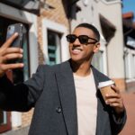stylish and cheerful african american man in sungl lkubybf