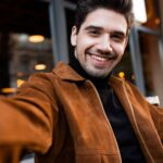 young handsome casual man happily taking selfie in fddyp4h